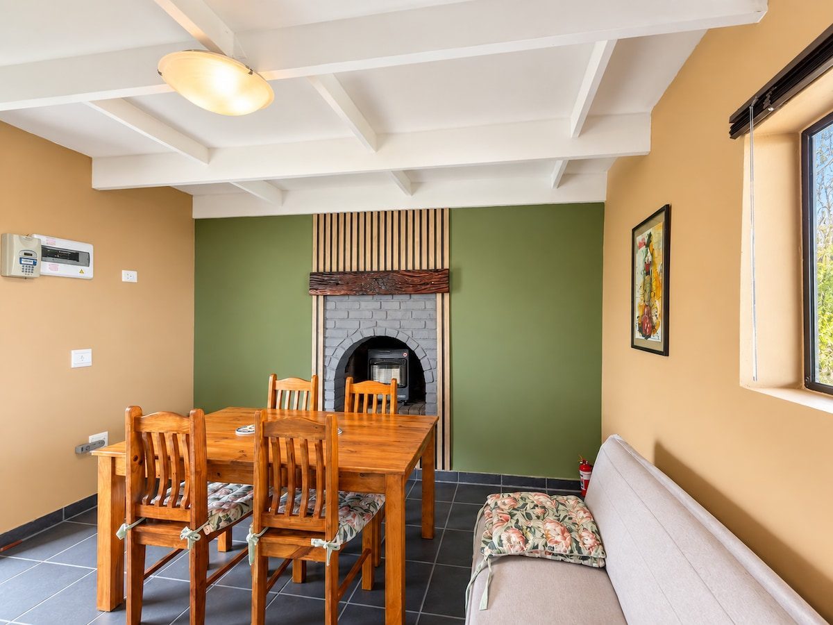 Living and dining area with sofa bed